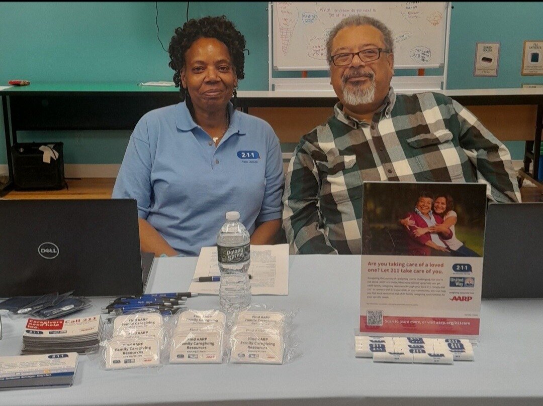 two adults sitting at resource table