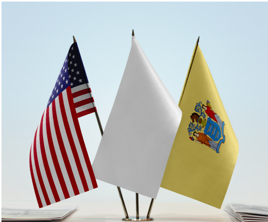 three small flags, left to right: USA, white, NJ state flag